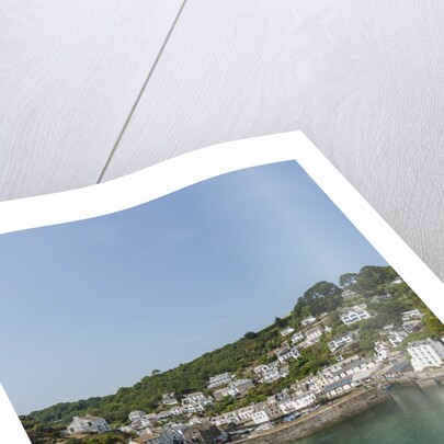 Polperro is a village with beautiful ancient houses along a canal by Anonymous