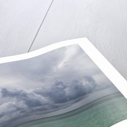 Rain clouds and thunderstorm at sea. by Anonymous