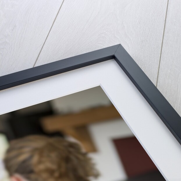 Woman watching TV with crutches by Anonymous
