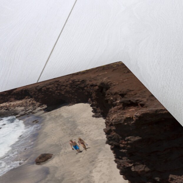 Couple walking on secluded beach at Shark's cove, Lanai, Hawaii MR by Anonymous