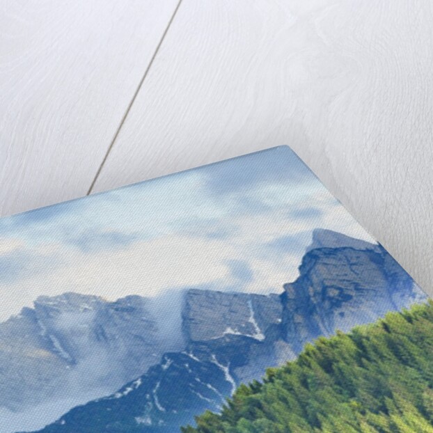 The mount Sernio emerges from the clouds and stands with majesty abiove the green woods, Alpi Carnic by Anonymous