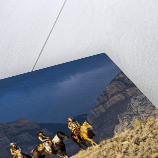 Cowboys and Cowgirls riding along the hills of the Big Horn Mountains by Anonymous