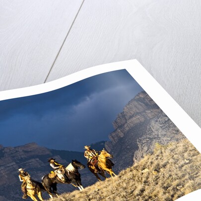 Cowboys and Cowgirls riding along the hills of the Big Horn Mountains by Anonymous
