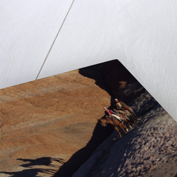 Riders with Shadow coming down Hill in Painted Desert by Anonymous
