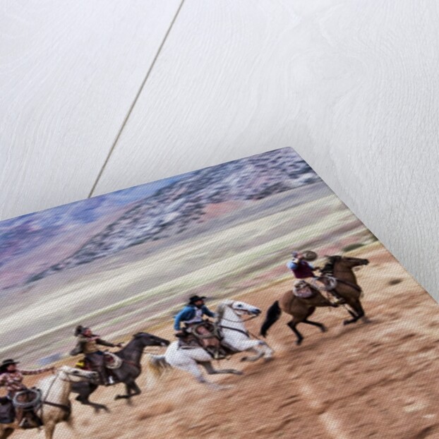 Cowboy's in motion across the field by Anonymous