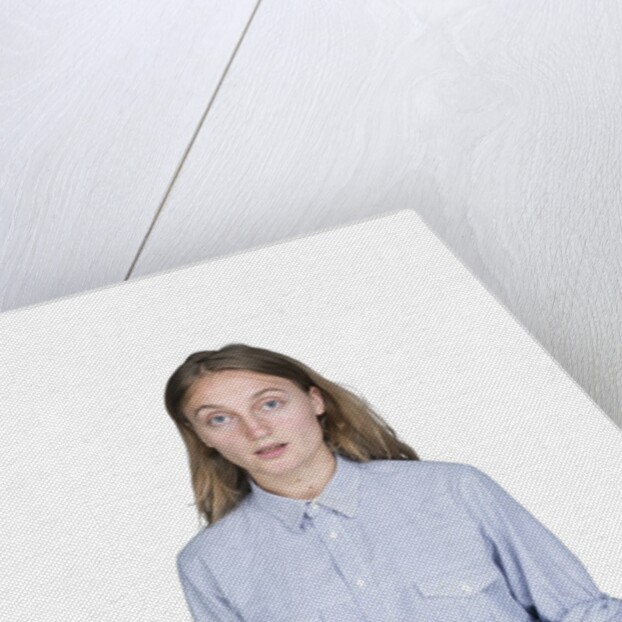 Portrait of teenage girl (16-17) on white background by Anonymous