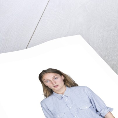 Portrait of teenage girl (16-17) on white background by Anonymous