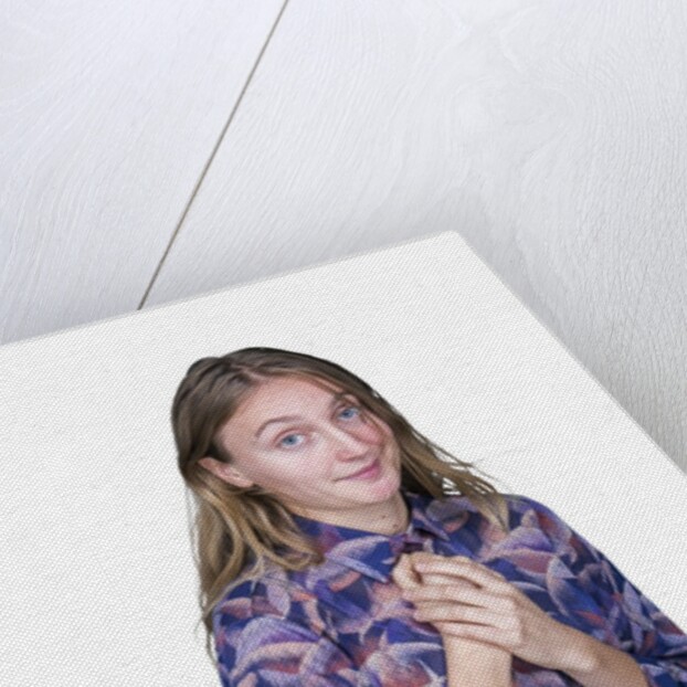 Portrait of teenage girl (16-17) on white background by Anonymous