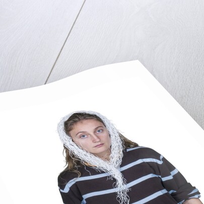 Portrait of teenage girl (16-17) on white background by Anonymous