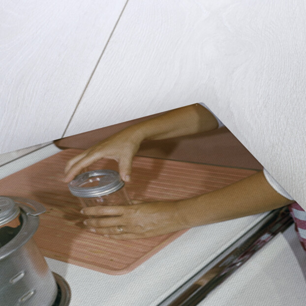 Woman Sterilizing Jars for Canning by Anonymous