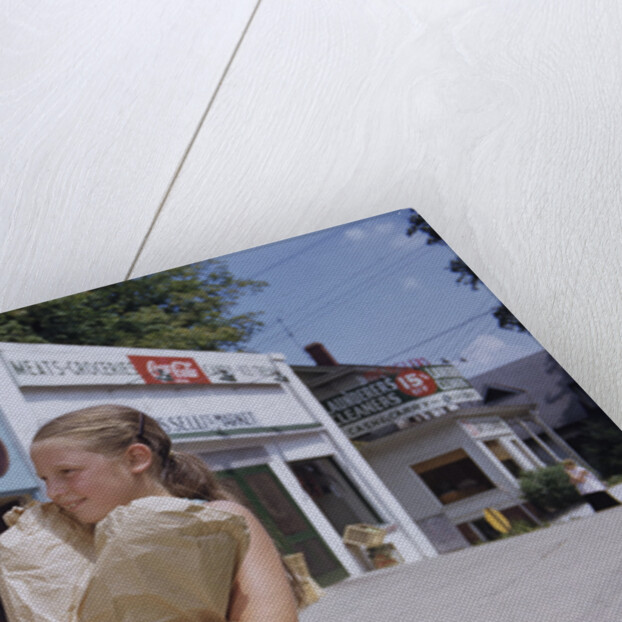 Girl Carrying Paper Shopping Bags by Anonymous