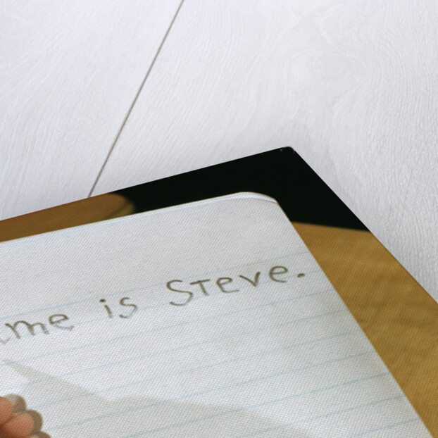 Schoolboy Writing Name in Notebook by Anonymous