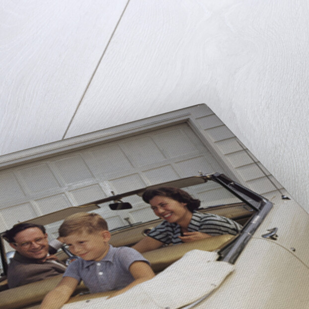 Family Sitting in Car Outside Garage by Anonymous