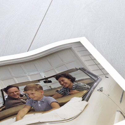 Family Sitting in Car Outside Garage by Anonymous