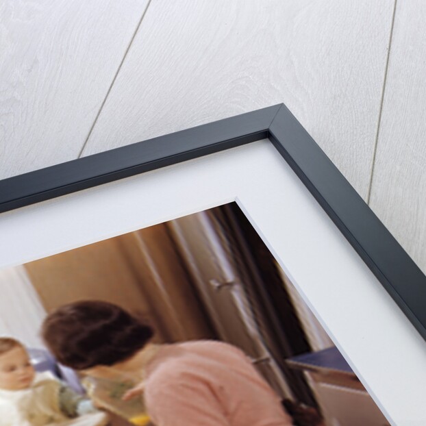 Family Eating Together at Dinner Table by Anonymous