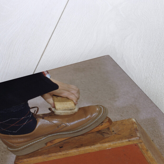 Man Buffing His Shoes by Anonymous