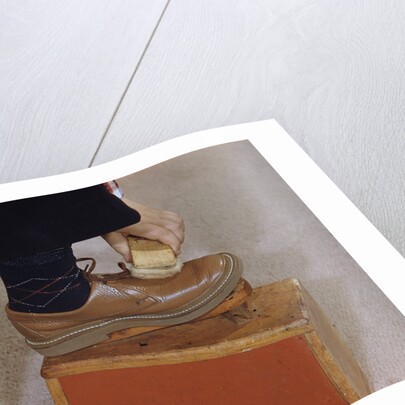Man Buffing His Shoes by Anonymous