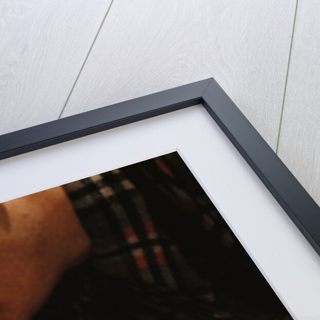Man Fixing Knob on Screen Door by Anonymous
