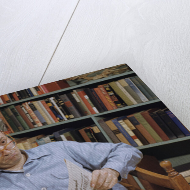 Man Holding Newspaper While Thinking by Anonymous