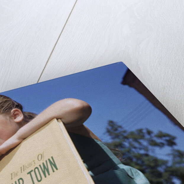Girl Holding Town History Book by Anonymous