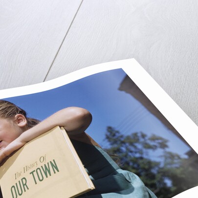 Girl Holding Town History Book by Anonymous