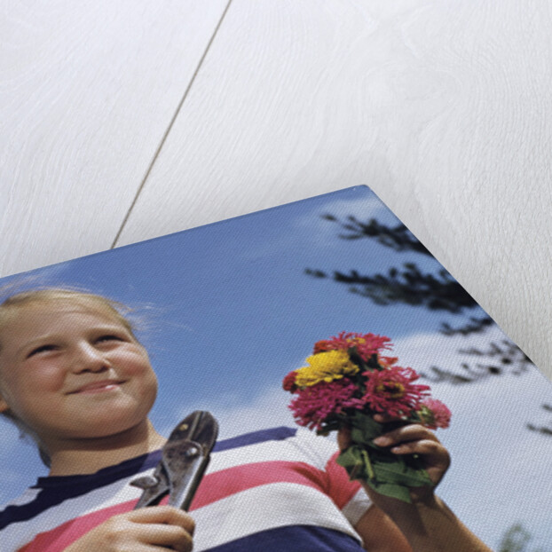 Girl Holding Cut Flowers by Anonymous