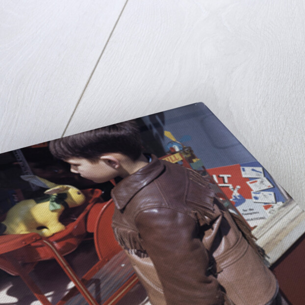 Boy Window Shopping at a Toystore by Anonymous