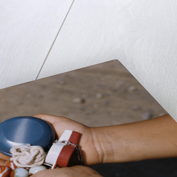 Child Holding Toys by Anonymous