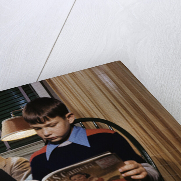 Father and Son Reading at Home by Anonymous