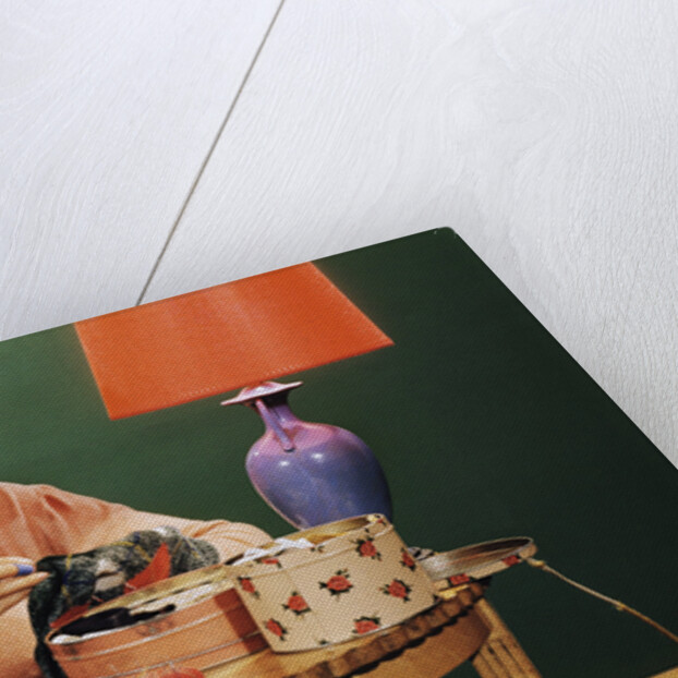 Woman Darning Socks by Anonymous