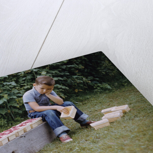 Bored Child Sitting with Raspberry Cartons by Anonymous