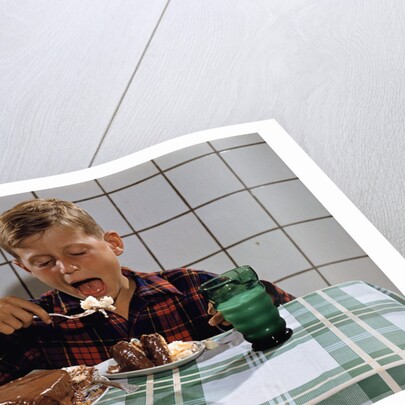 Boy Eating a Slice of Cake by Anonymous