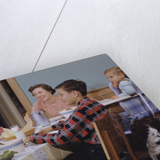 Family Eating at the Dinner Table by Anonymous
