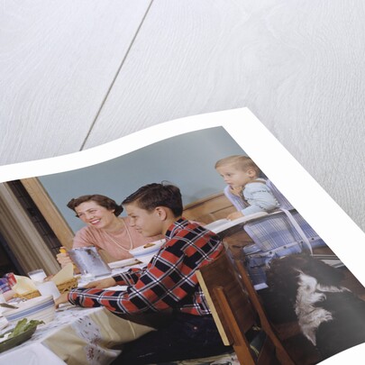 Family Eating at the Dinner Table by Anonymous