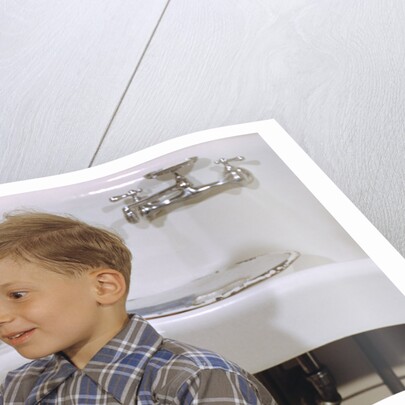 Boy Drying Serving Spoon by Anonymous
