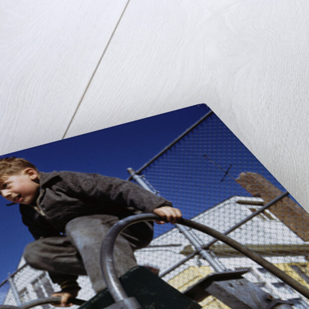 Boy Playing on Playground Slide by Anonymous