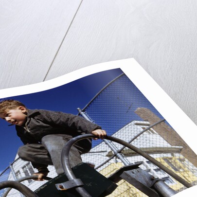 Boy Playing on Playground Slide by Anonymous