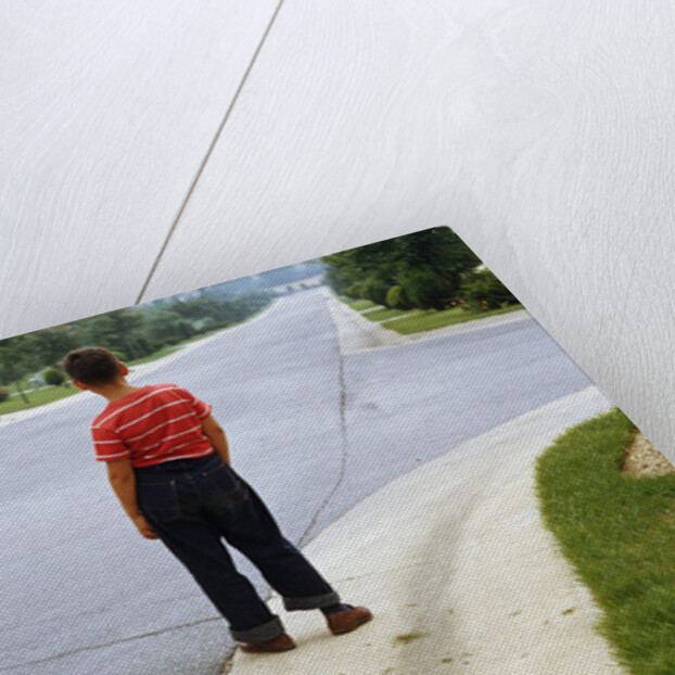 Boy Waiting on Suburban Street by Anonymous