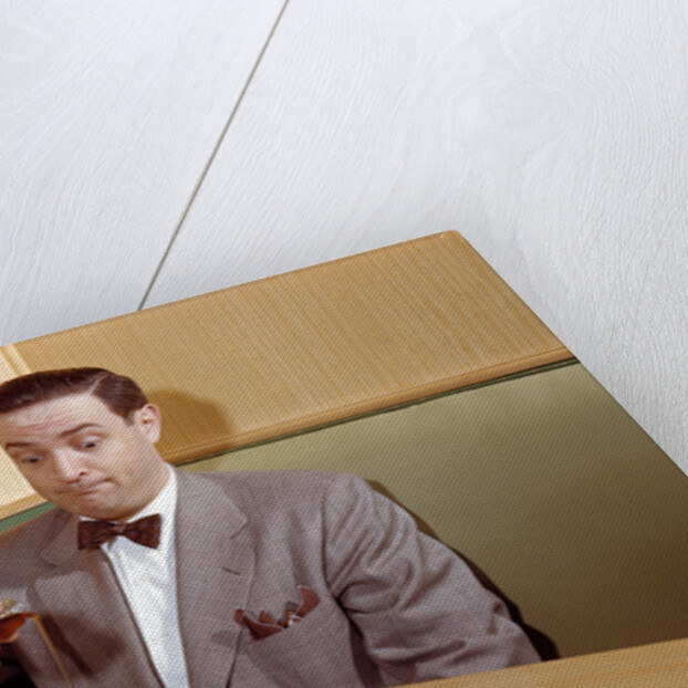 Businessman Pouring Syrup on Pancakes by Corbis