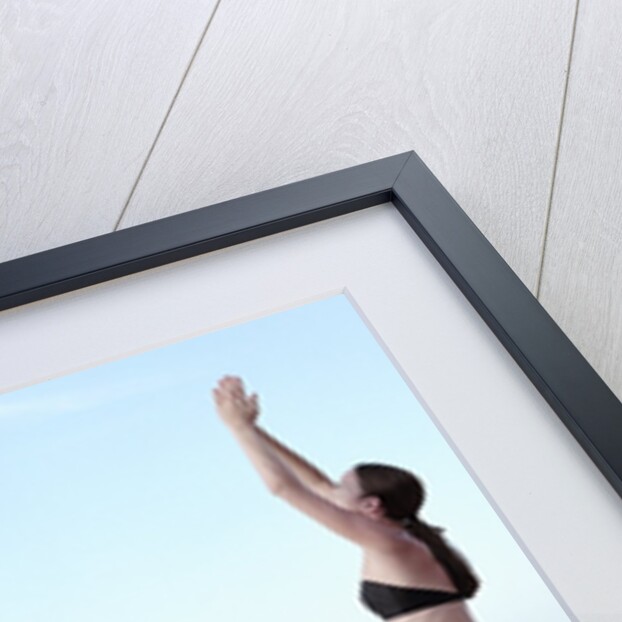 Woman Exercising on Swimming Pool Edge by Anonymous