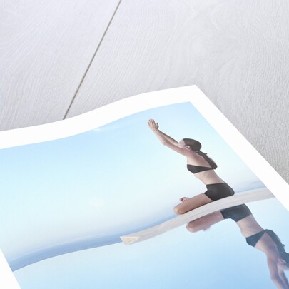 Woman Exercising on Swimming Pool Edge by Anonymous