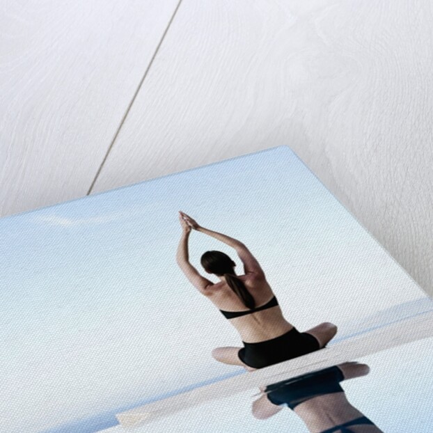 Woman Exercising on Swimming Pool Edge by Anonymous