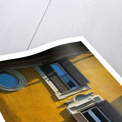 Shuttered Windows on Yellow Building by Anonymous