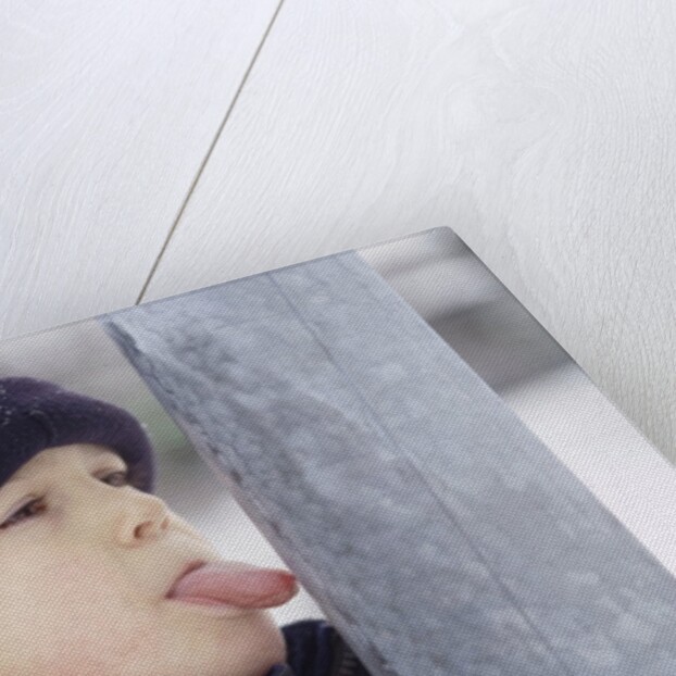 Boy Putting Tongue to Frozen Pole by Anonymous