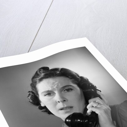 Anxious Woman On The Telephone by Anonymous