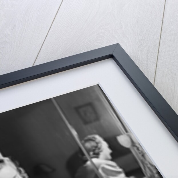 Woman Putting On Stockings by Anonymous