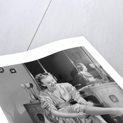 Woman Putting On Stockings by Anonymous