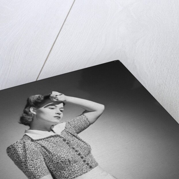 Woman Hard at Work Ironing by Anonymous