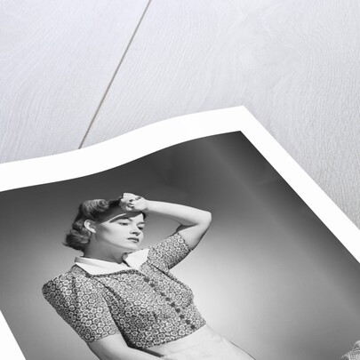 Woman Hard at Work Ironing by Anonymous