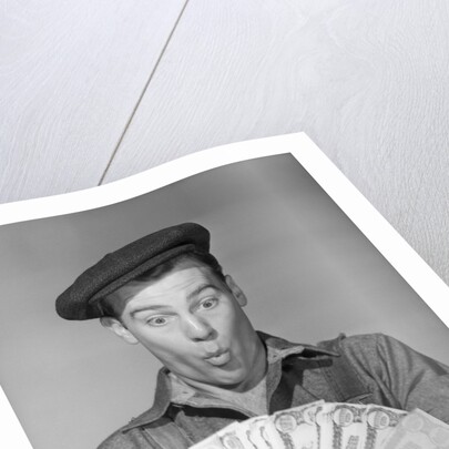 Man Holding Fan of Money by Anonymous